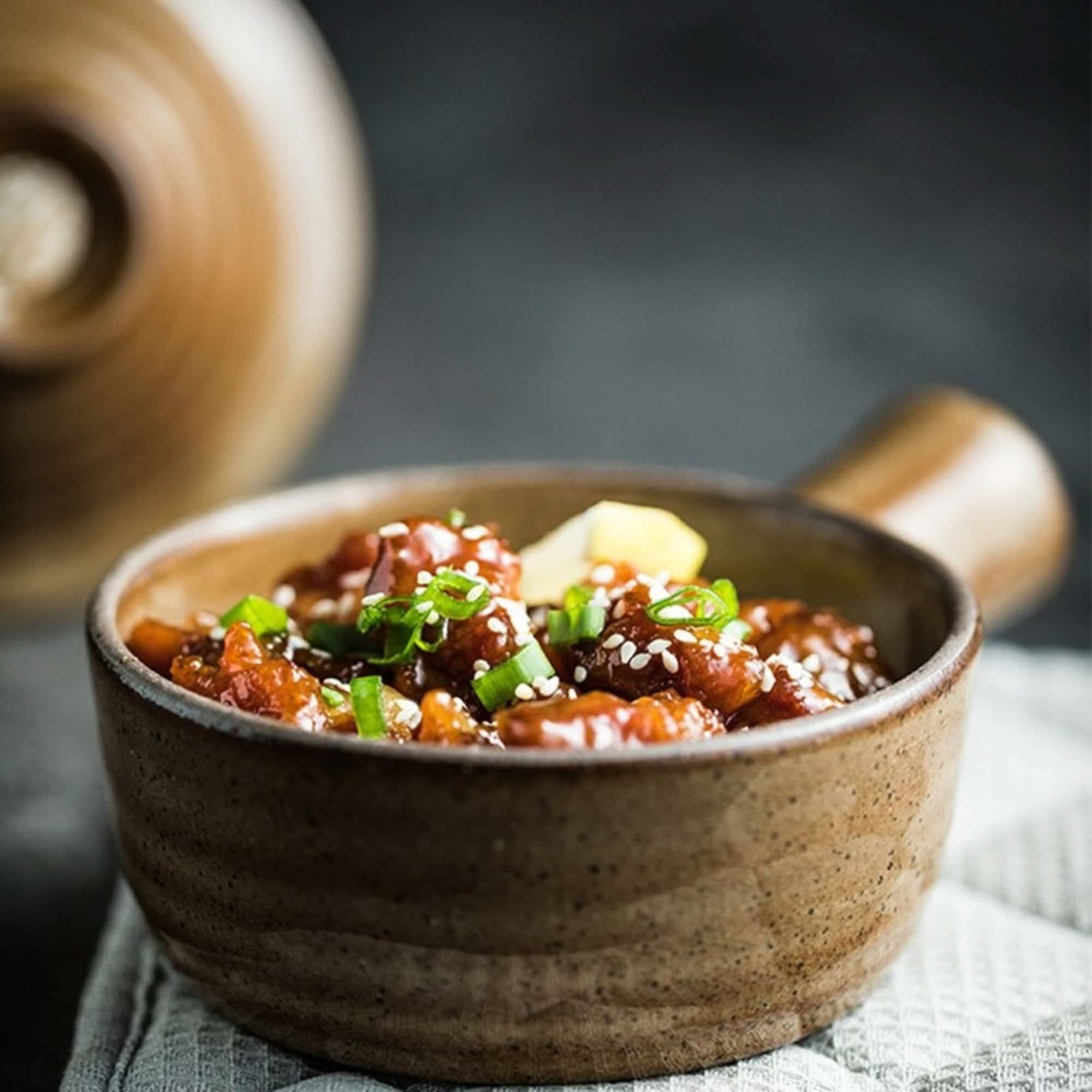 Nordic Stoneware Glazed Baking Plate serving glazed chicken with sesame seeds.